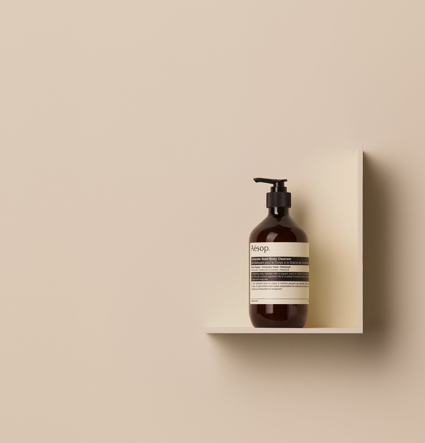 500ml bottle of Aesop Coriander Seed Body Cleanser placed on a shelf