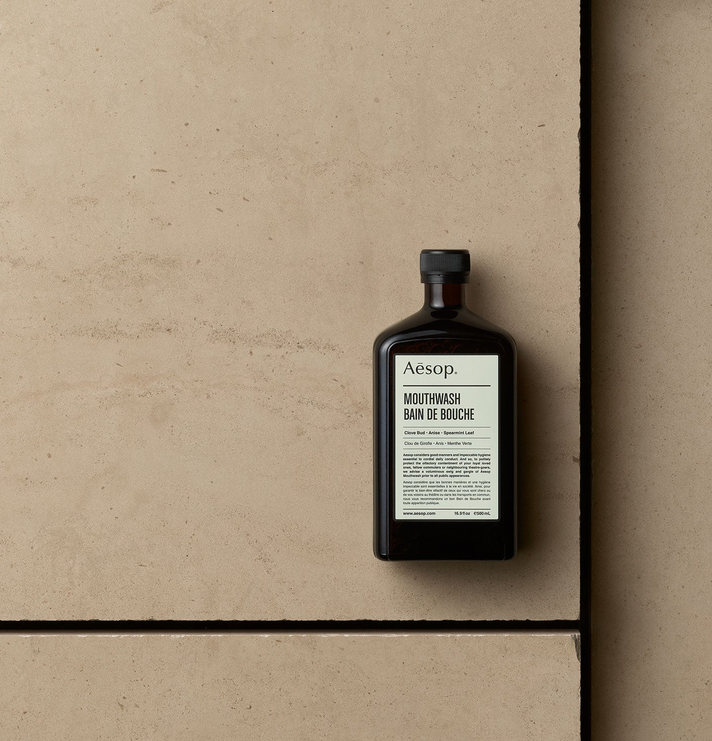 500ml Bottle of Aesop Mouthwash on a floor tile