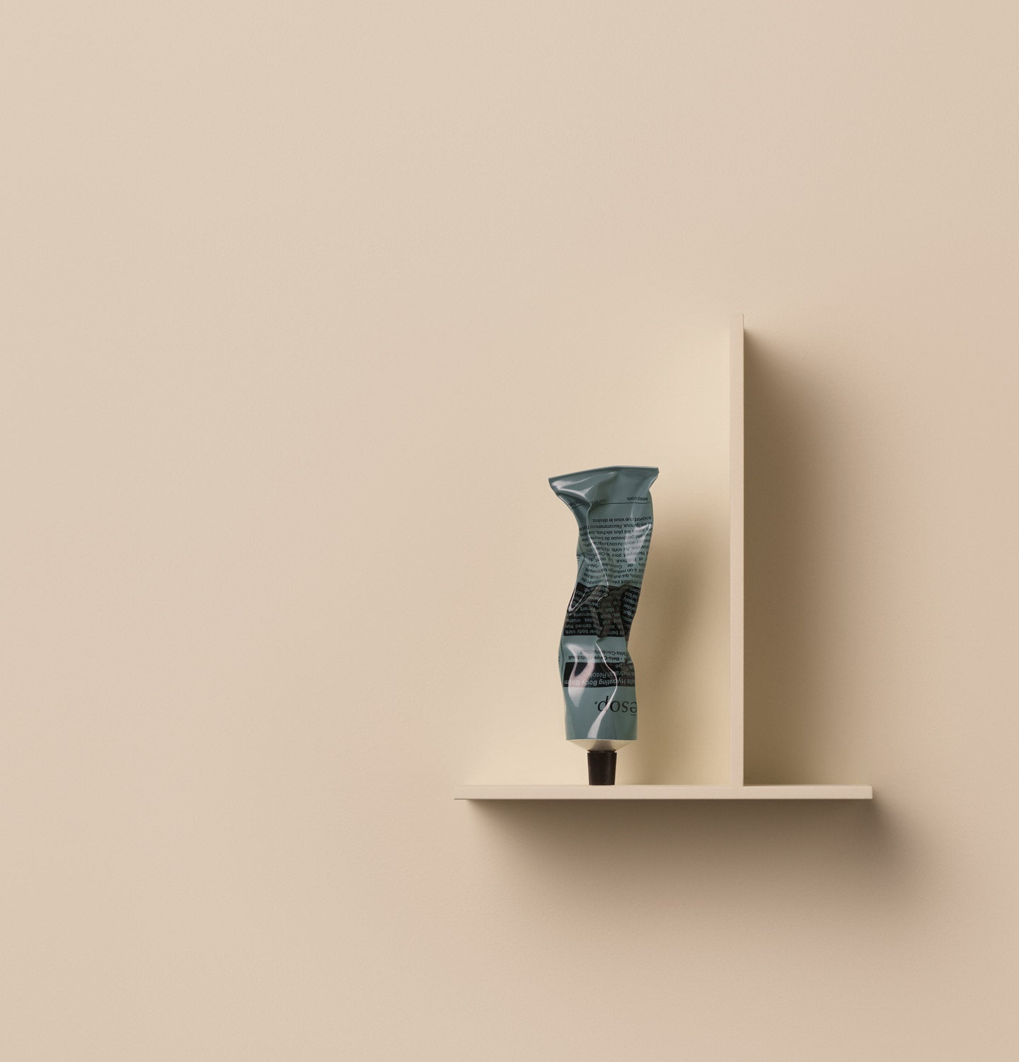 100ml tube of Aesop Resolute Hydrating Body Balm placed on a shelf