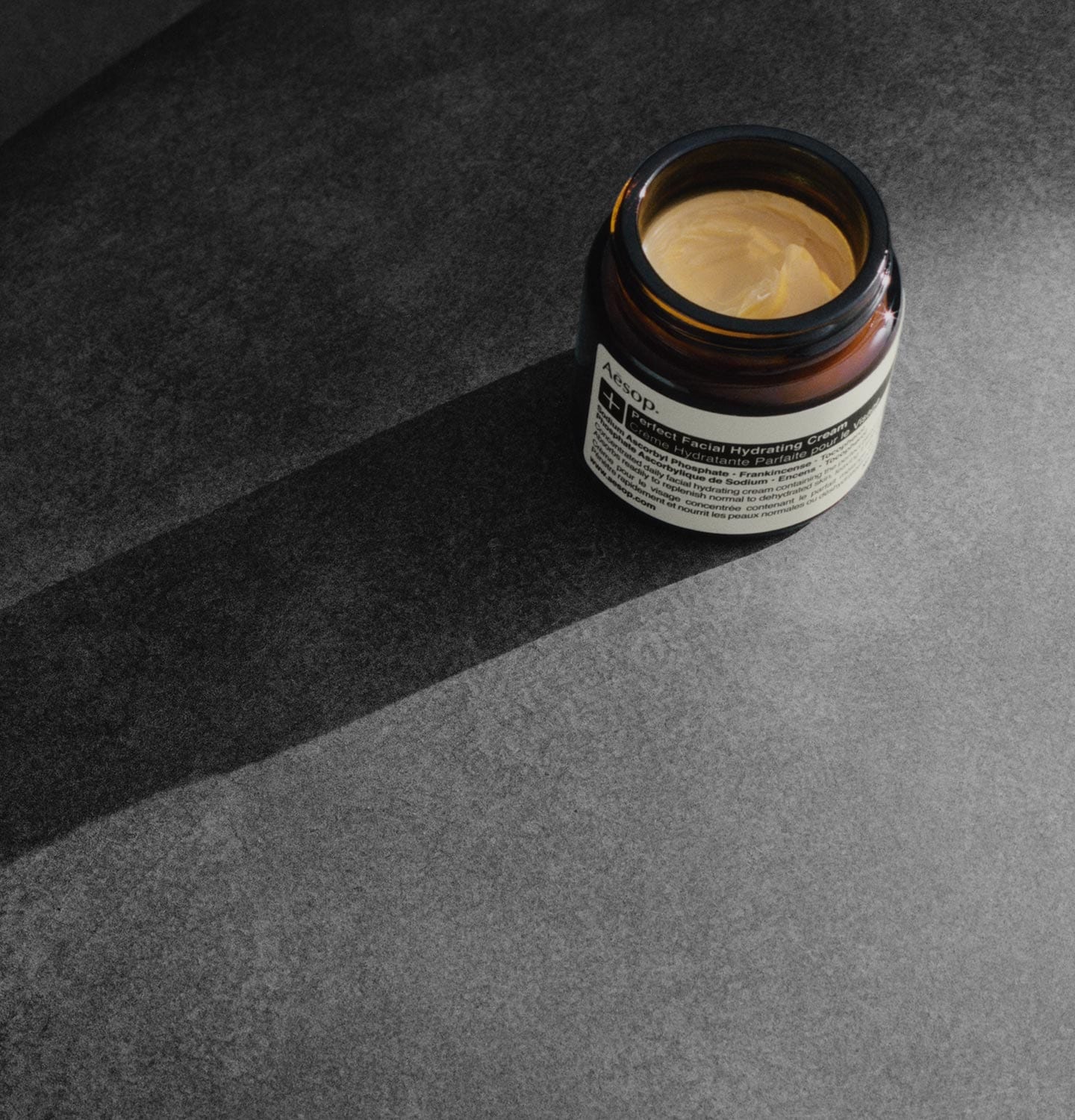 An open tub of Aesop Perfect Facial Hydrating Cream