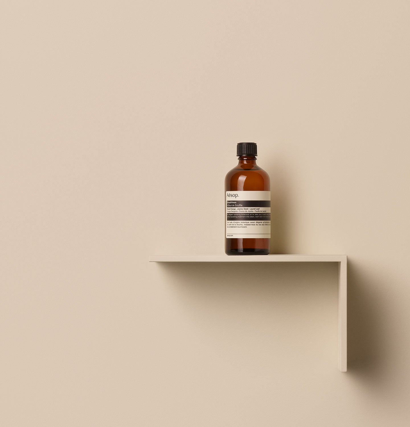 100ml bottle of Aesop Breathless body oil on a shelf