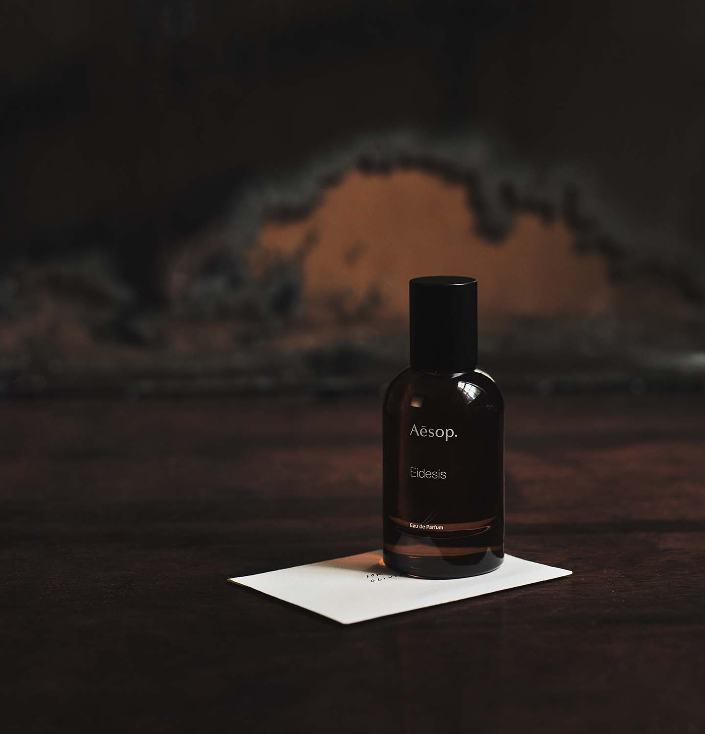 50ml bottle of Aesop Eidesis eau de parfum placed on an envelope