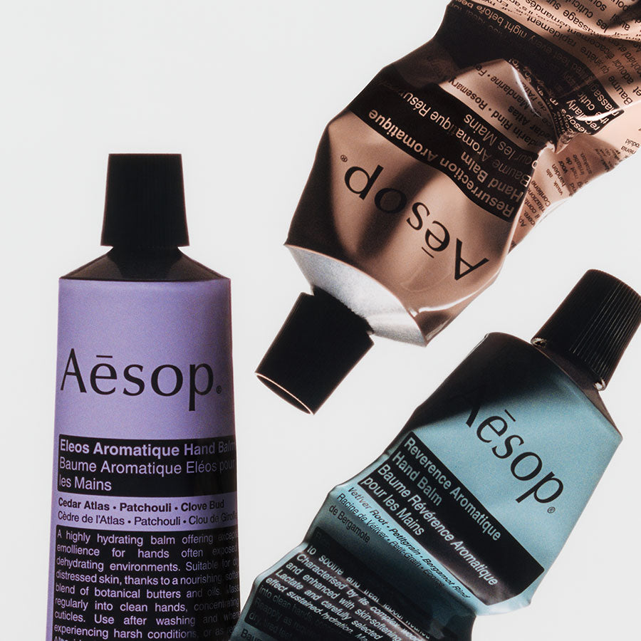 3 tubes of Aesop hand balm placed in a random fashion