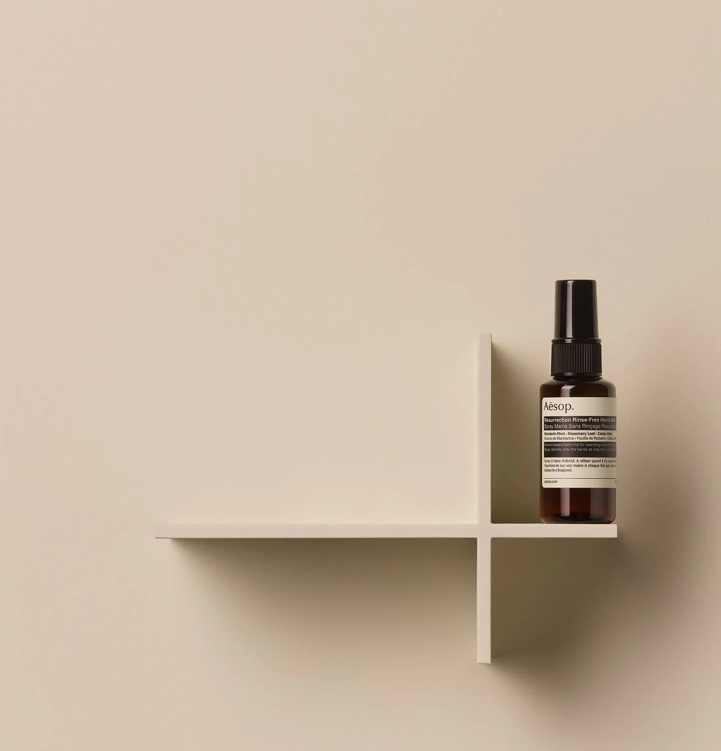50ml spray bottle of Aesop Resurrection Rinse Free Hand Mist on a shelf