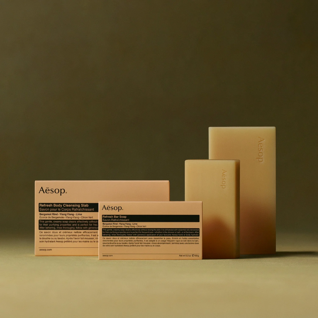 310g and 150g bars of Aesop Refresh Body Cleansing Slab places beside their boxes